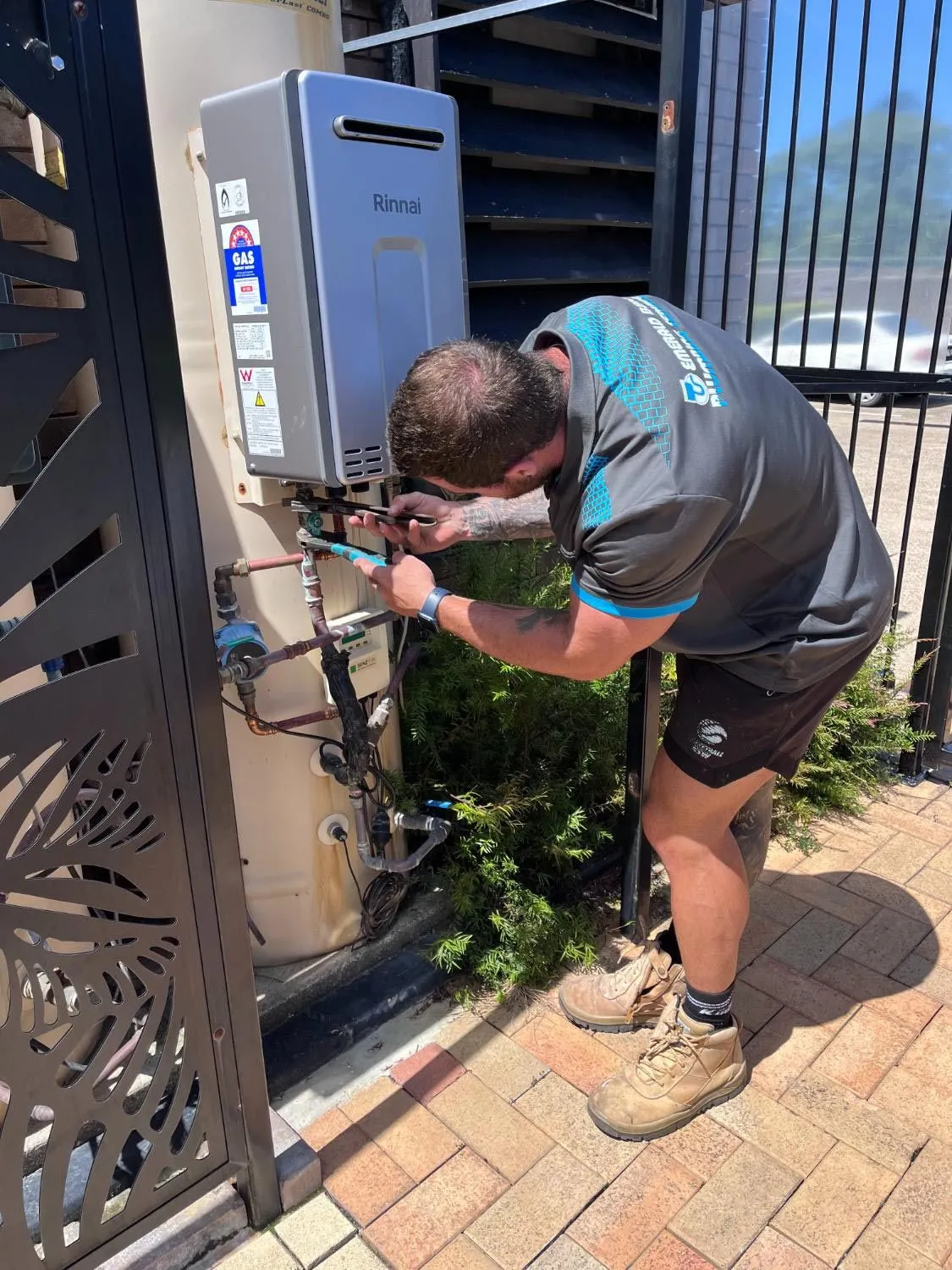 plumber servicing a gas system